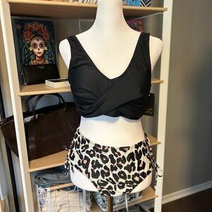 Bikinix Bikini Top with Leopard Print Bottoms with braided sides . Size M NWT